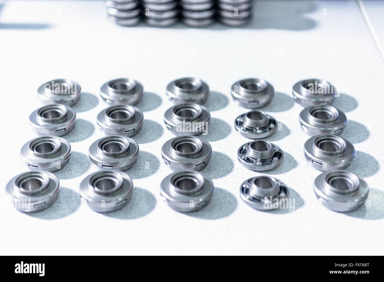Valve rotators on assembly line in automotive parts factory Stock Photo
