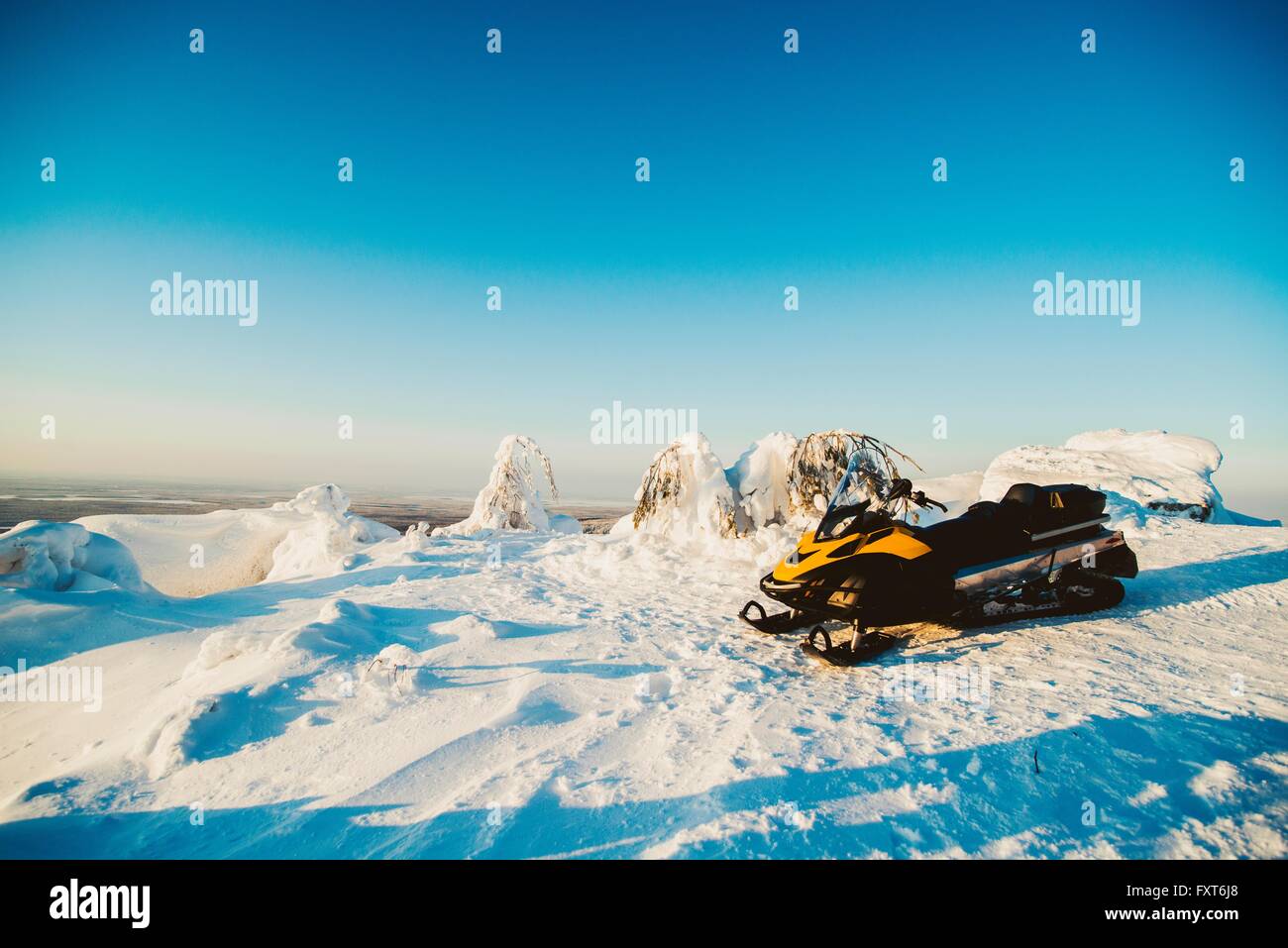 Snow vehicle parked on snowy landscape, Russia Stock Photo