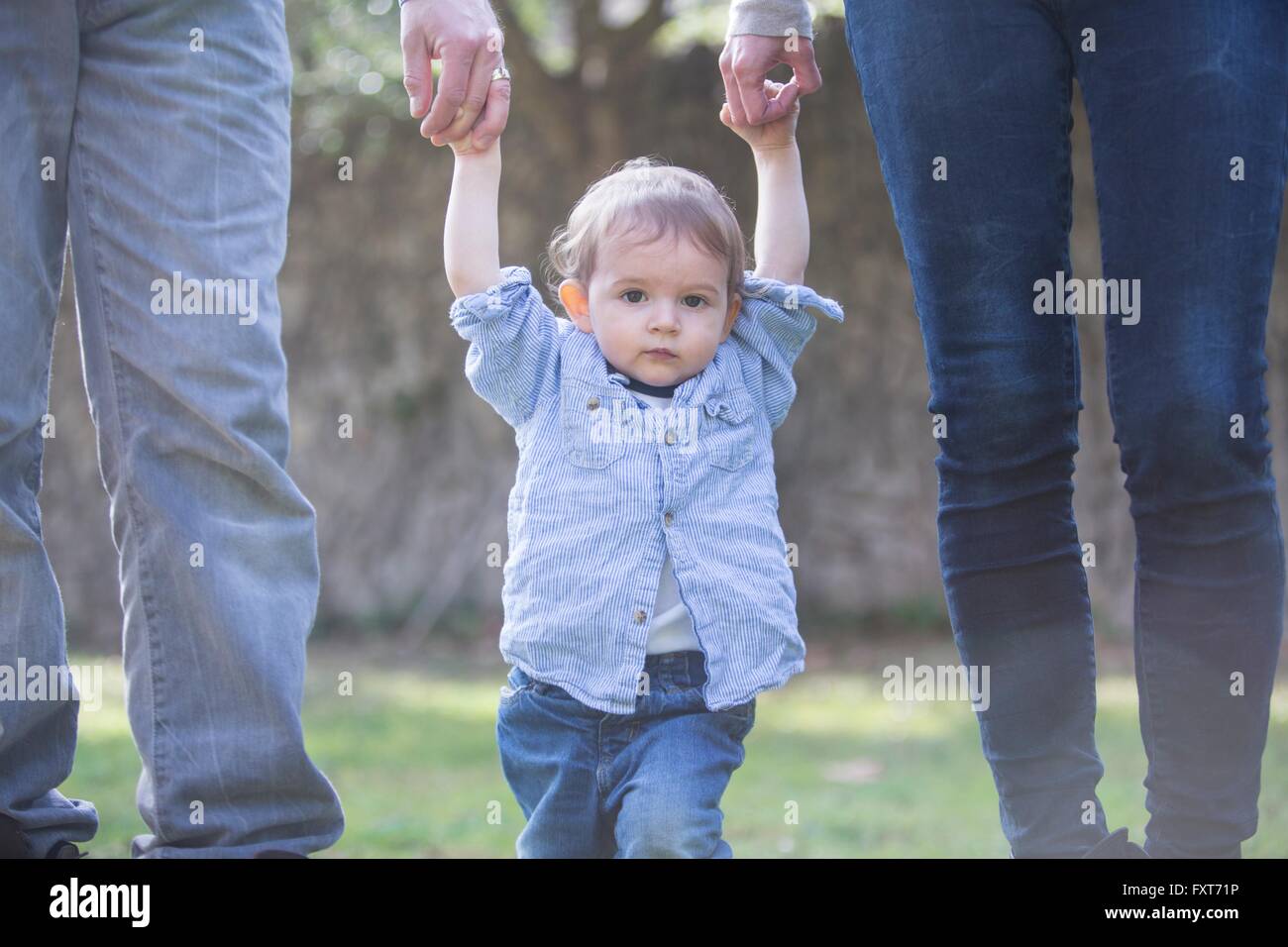 Two boys holding hands hi-res stock photography and images - Alamy