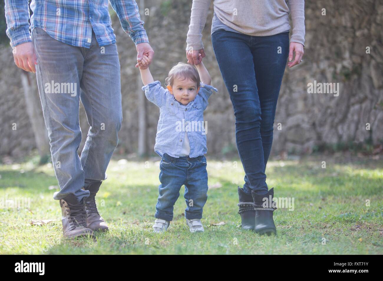 Two boys holding hands hi-res stock photography and images - Alamy