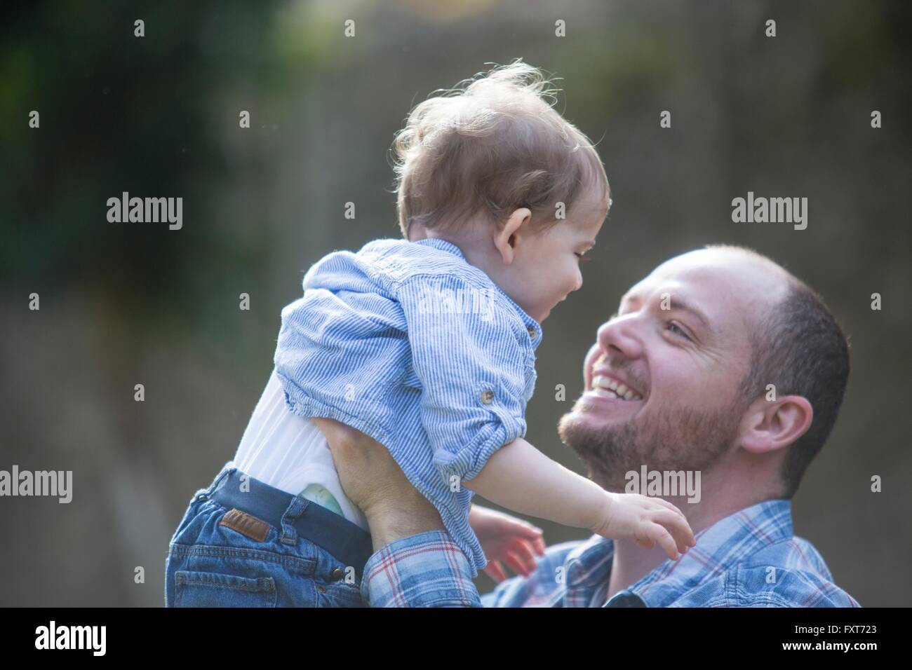 Father holding baby son Stock Photo