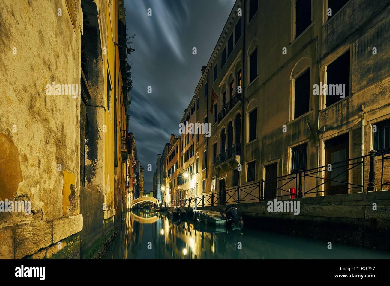 Canal and traditional waterfront houses at night, Venice, Italy Stock