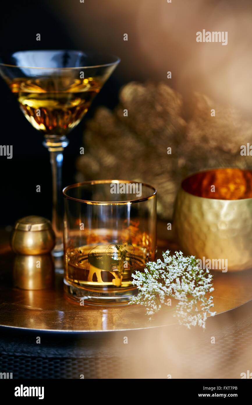 Drinking glasses on golden tray Stock Photo