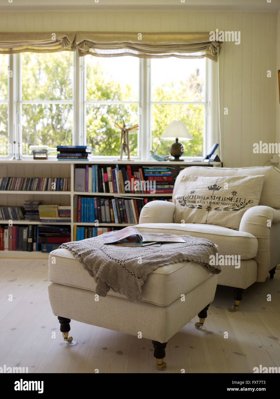 Traditional living room with armchair and footstool Stock Photo