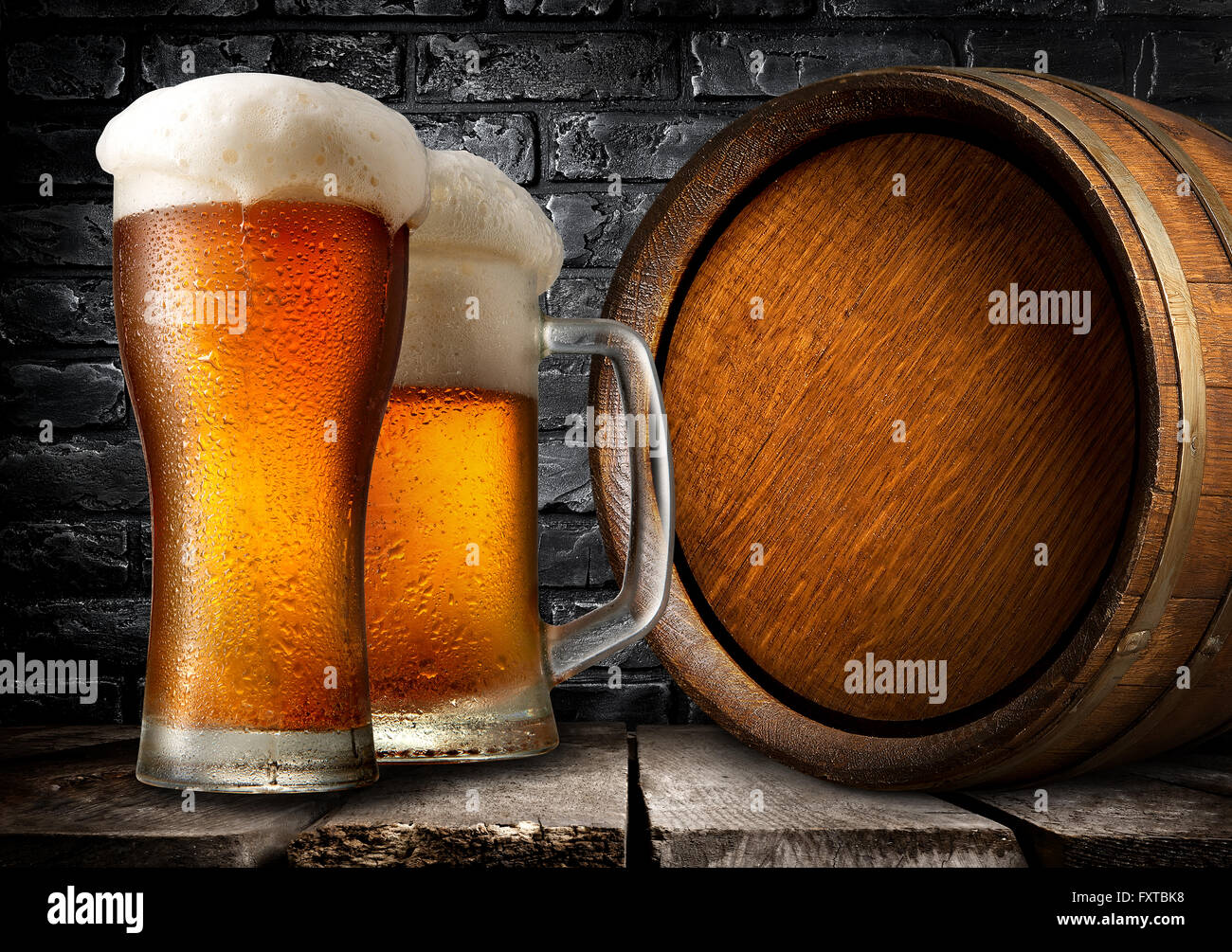 Wooden keg and beer near black brick wall Stock Photo