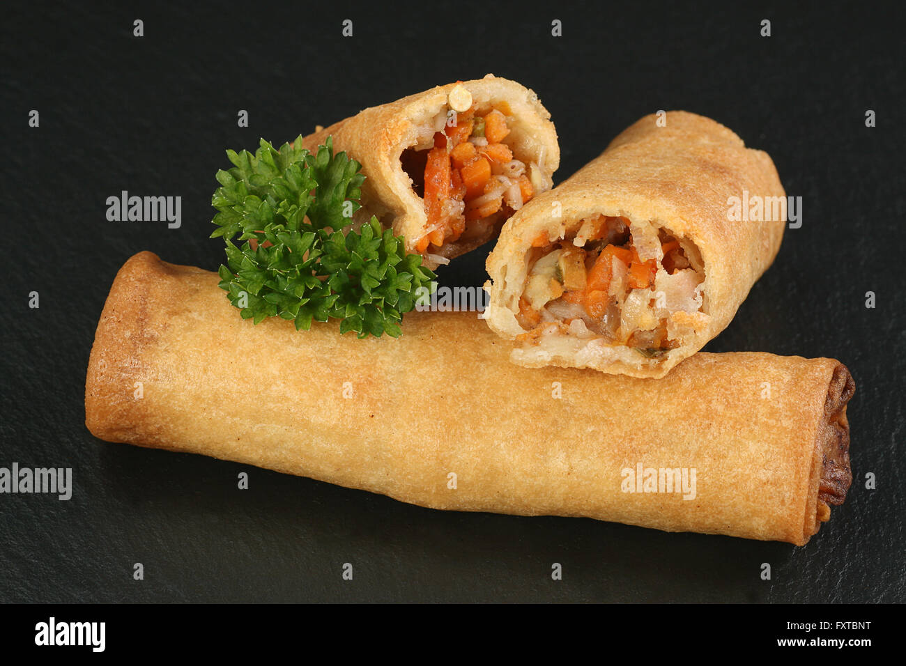 asian chinese vegetable spring rolls showing filling Stock Photo Alamy