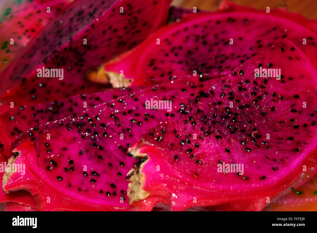 Dragon fruit exotic tropical fruit with black seeds inside Stock Photo -  Alamy