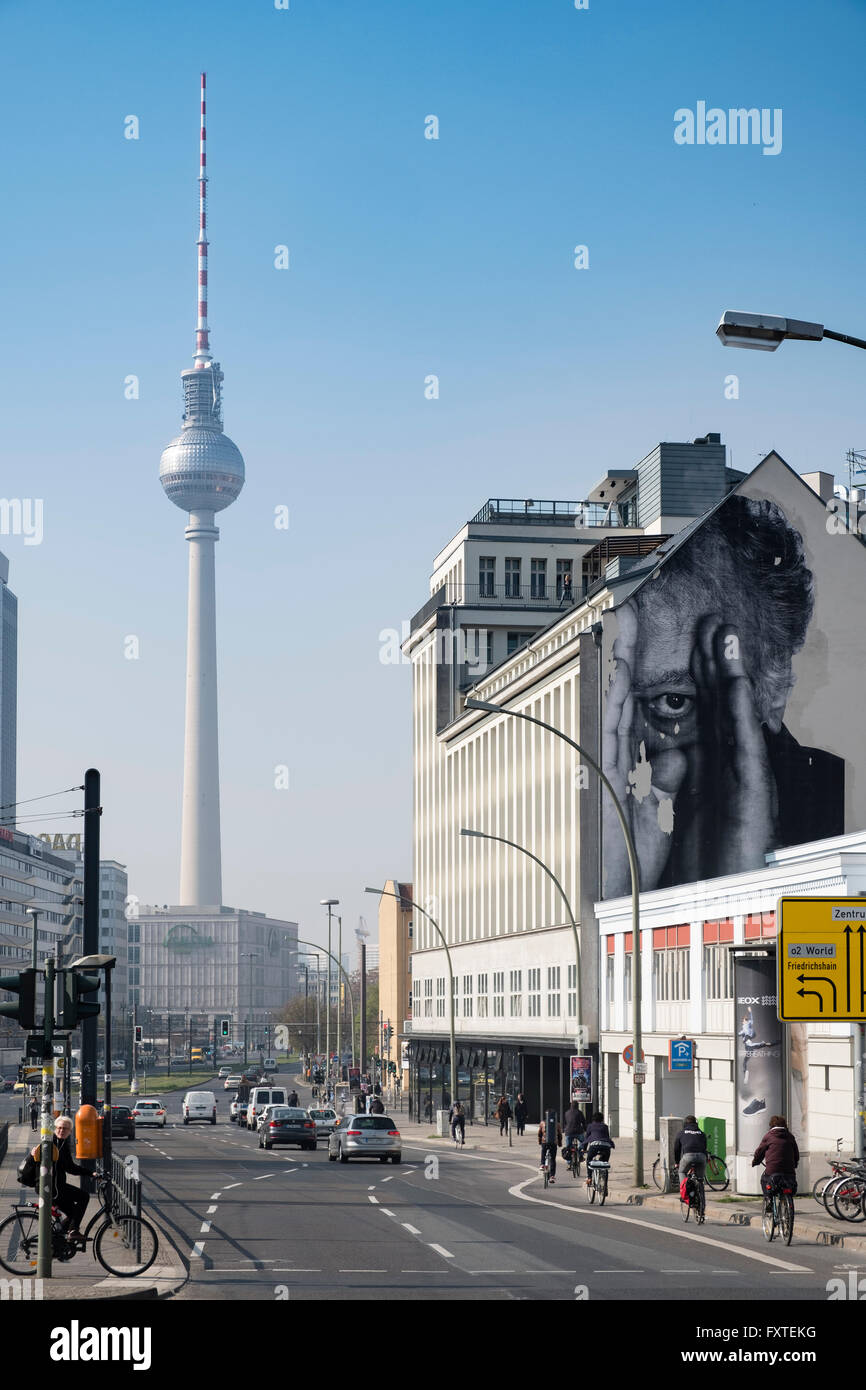 'JR' mural on building wall and Television Tower in Berlin Germany Stock Photo