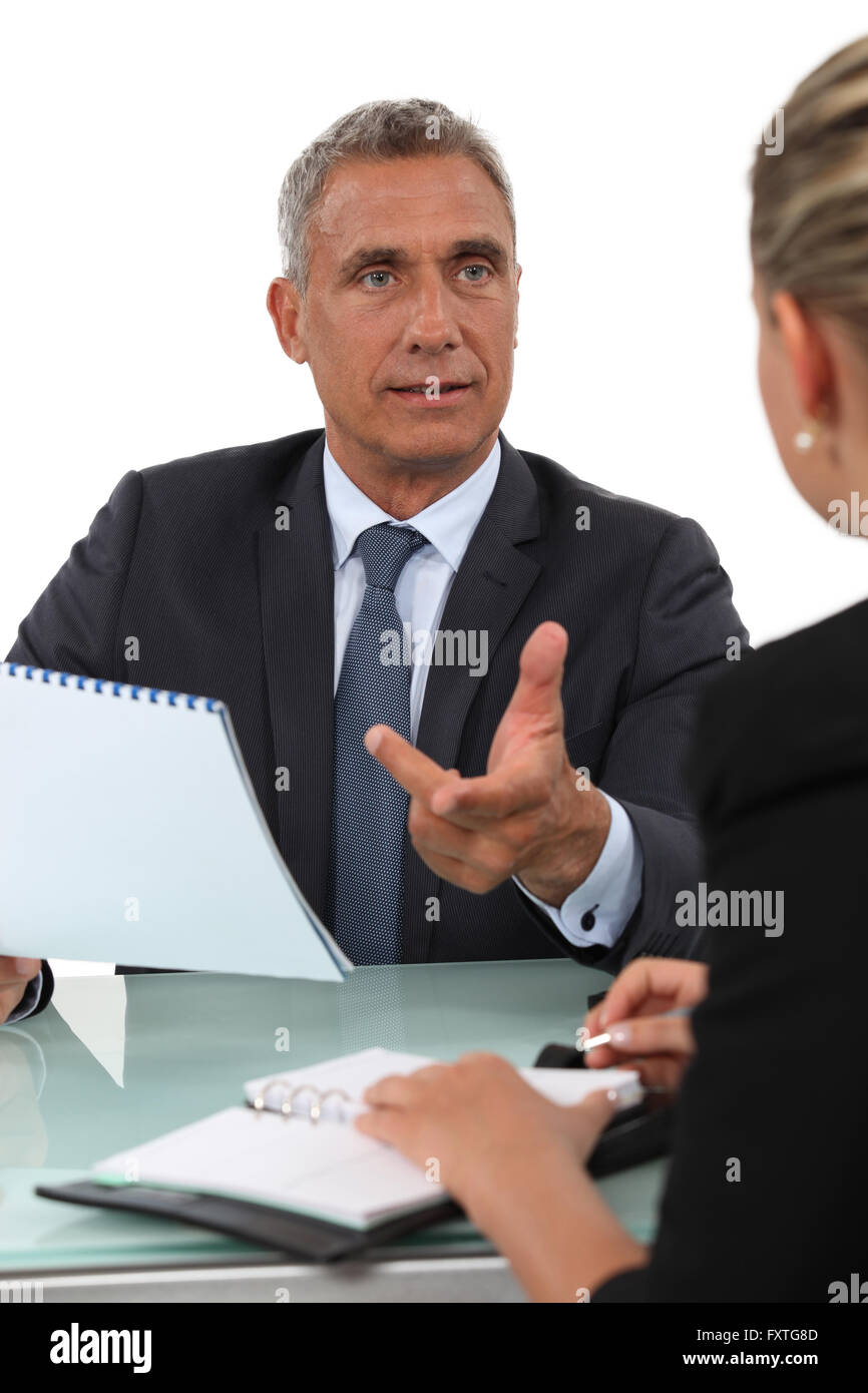 Colleagues exchanging ideas Stock Photo Alamy