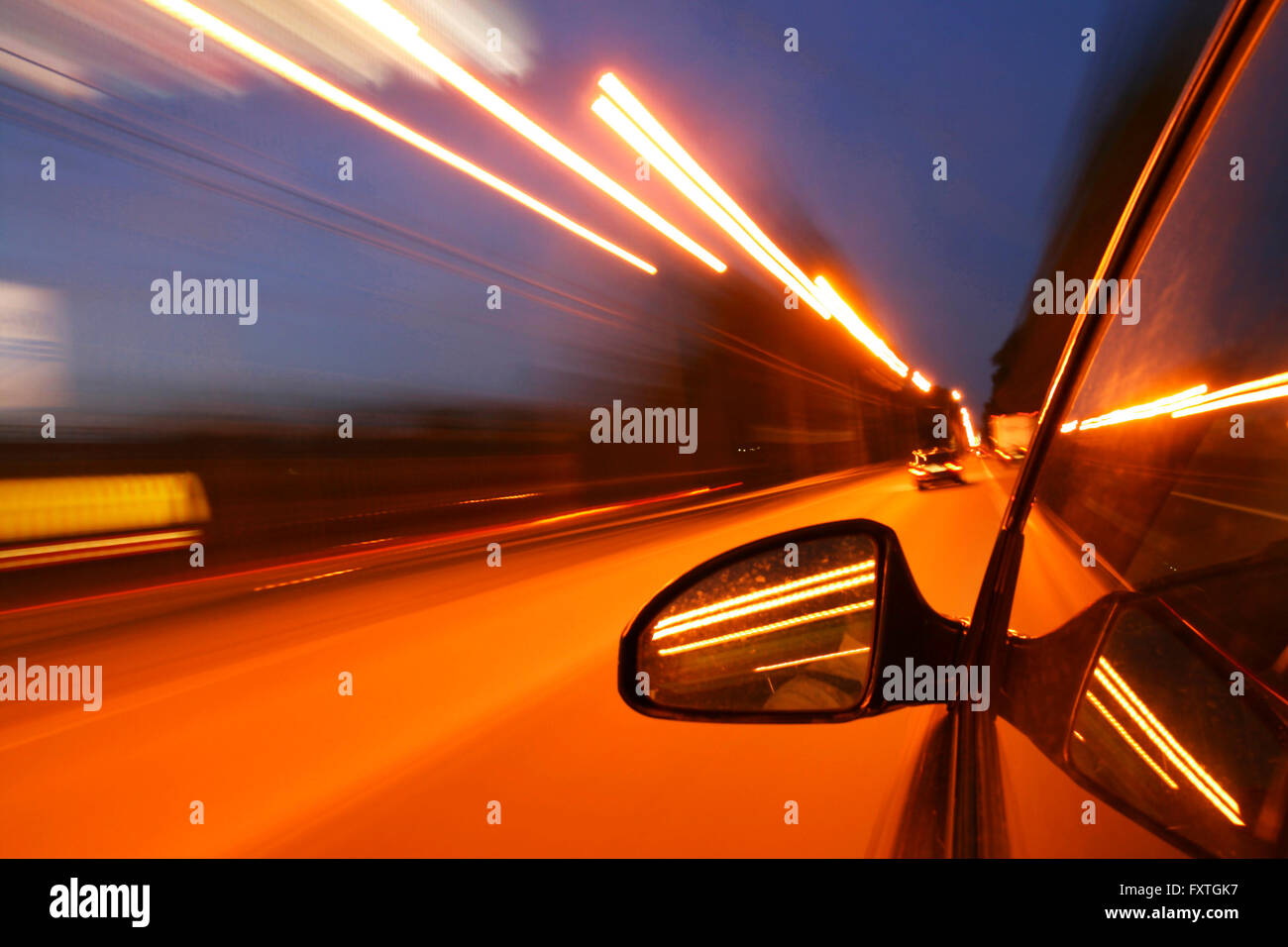 speed drive on car at night motion blurred Stock Photo