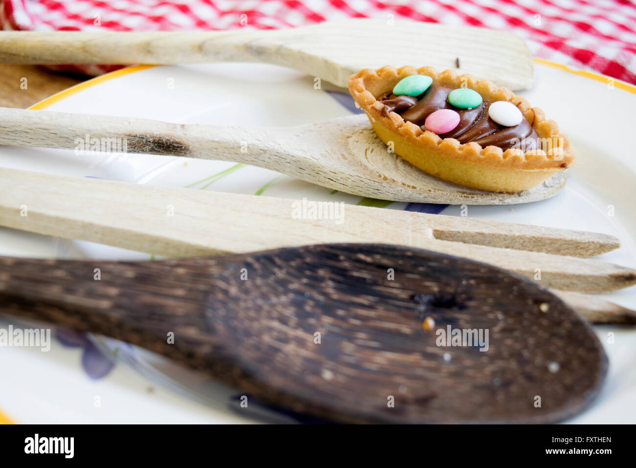 pastry with chocolate cream and colored sugared almonds Stock Photo