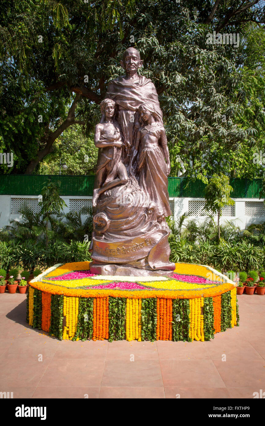 A statue of Mahatma Ghandi in the gardens of Gandhi Smriti formerly known as Birla House or Birla Bhavan in New Delhi, India Stock Photo