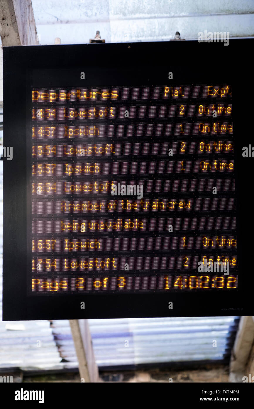 Railway departure board showing the 16:54 service to Lowestoft cancelled due to staff shortages, Saxmundham, Suffolk, UK. Stock Photo