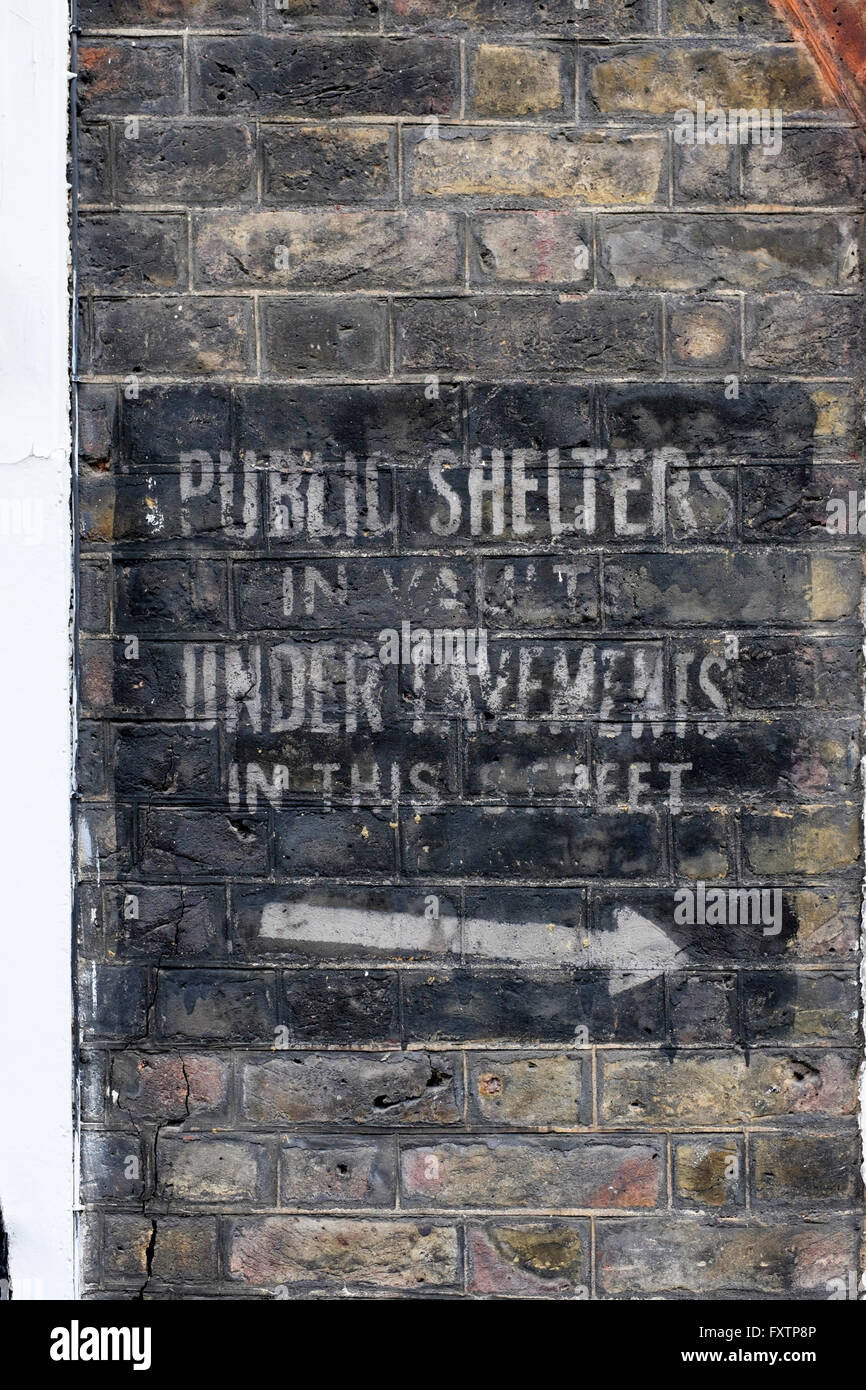Faded World War II sign showing location of public air raid shelters, Lord North Street, London, England, UK Stock Photo