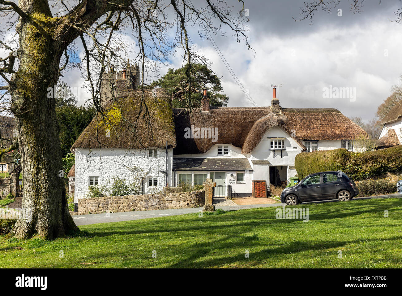The village green at North Bovey showing thatched cottages and the