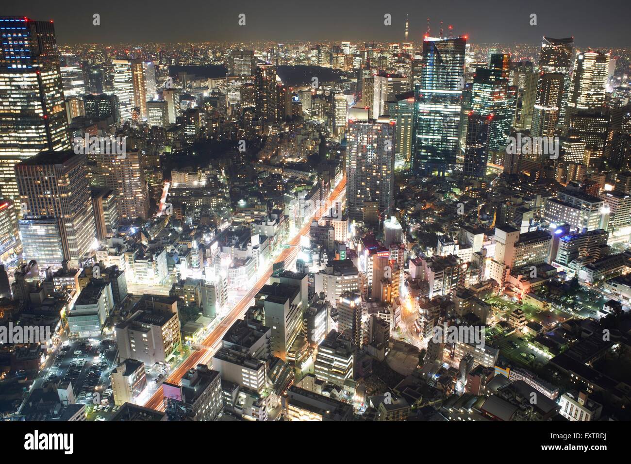 Cityscape view with skyscrapers and city lights at night, Tokyo, Japan Stock Photo