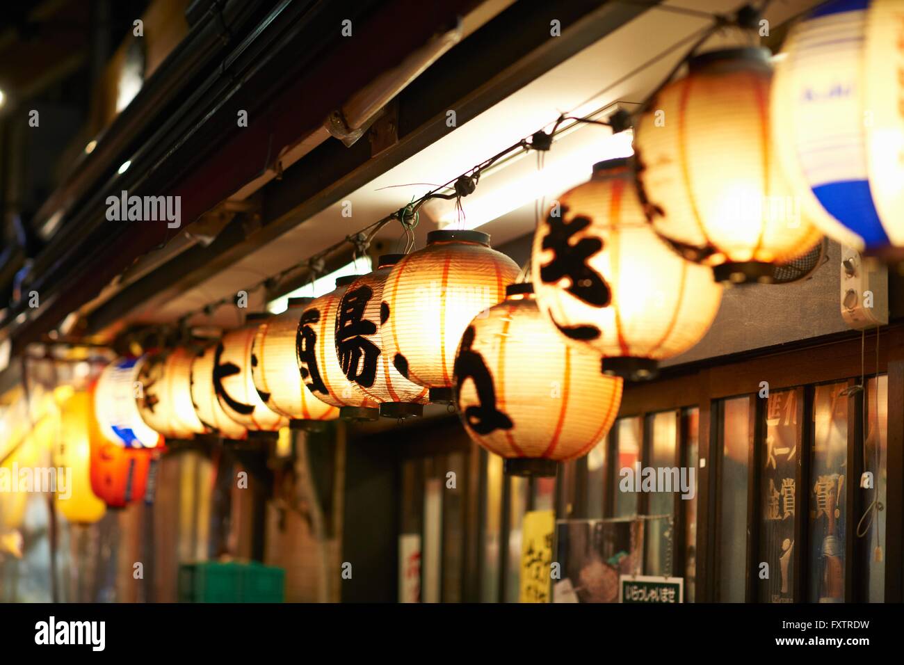 Row of illuminated paper lanterns at night, Tokyo, Japan Stock Photo - Alamy