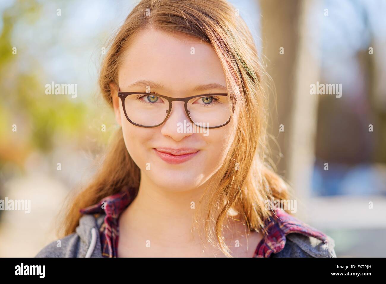 Portrait of teenage girl, smiling, close-up Stock Photo