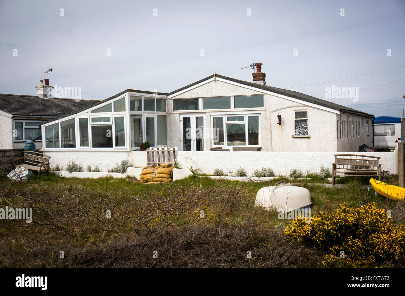 Railway carriage house on Pagham Beach near Chichester, West Sussex, UK