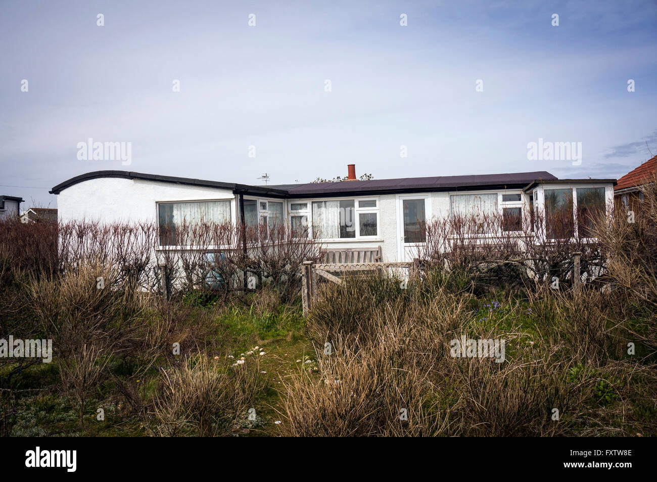 Railway carriage house on Pagham Beach near Chichester, West Sussex, UK Stock Photo