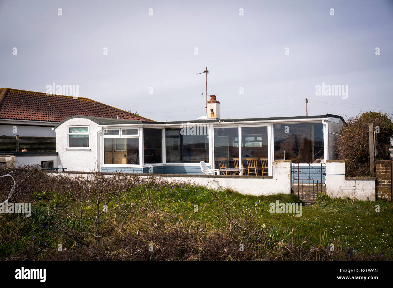 Railway carriage house on Pagham Beach near Chichester, West Sussex, UK