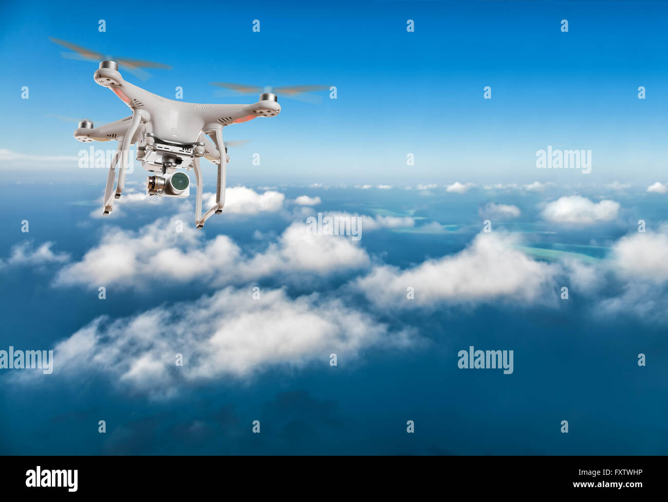 Drone for industrial works flying above clouds. Concept of pottential danger of aircraft collision Stock Photo