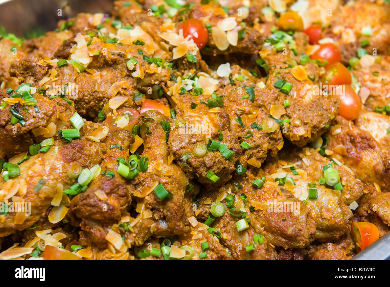Delicious Malay style spicy chicken drumstick dry curry Stock Photo Alamy
