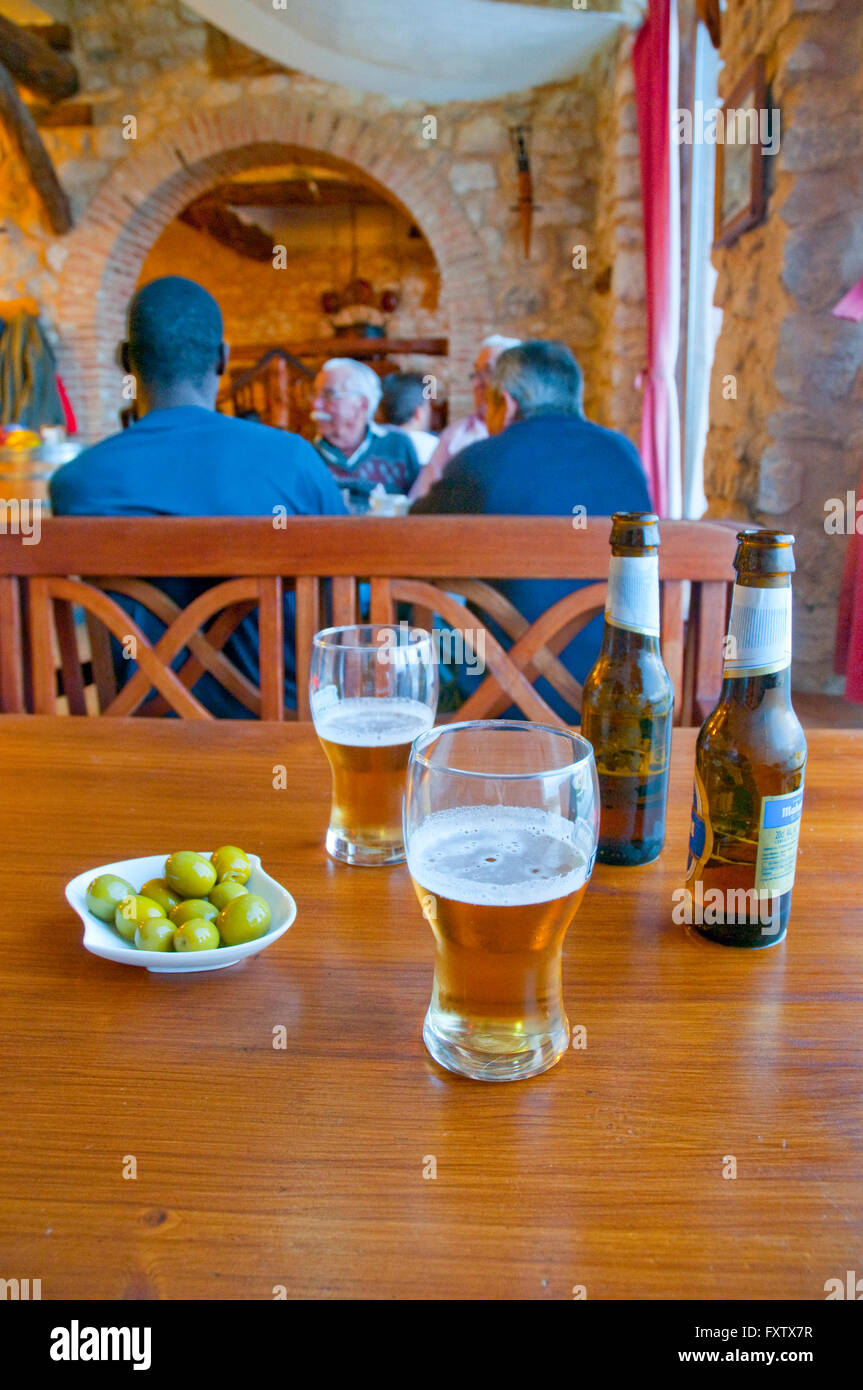 Two glasses of beer and green olives in a bar. Spain. Stock Photo