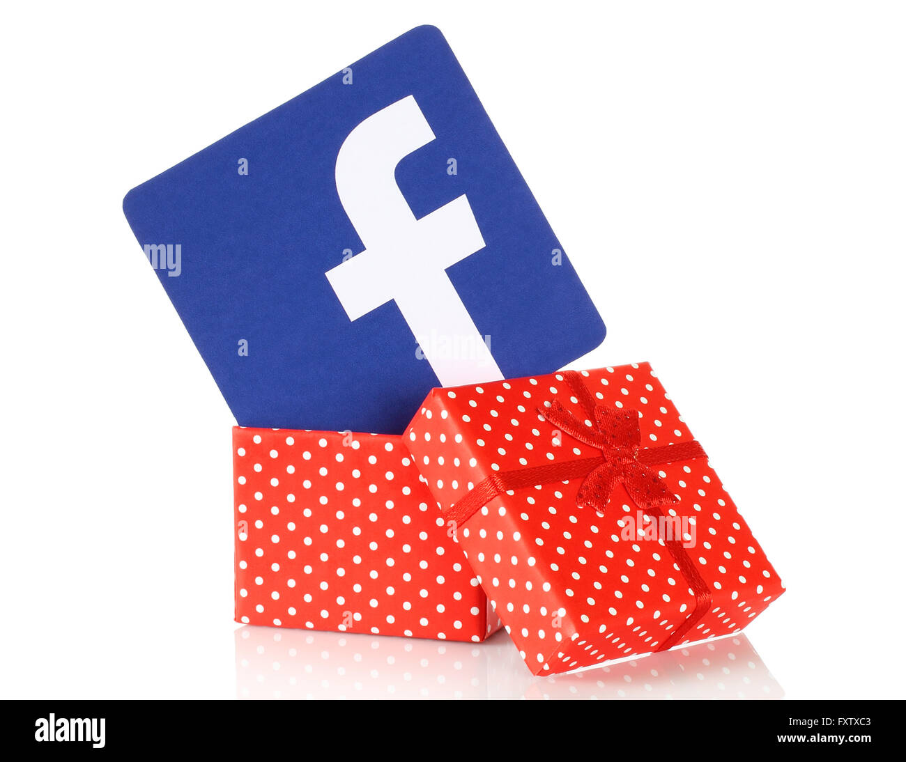 Kiev, Ukraine - January 11, 2016: Facebook logo printed on paper and put into present box on white background. Facebook is a wel Stock Photo