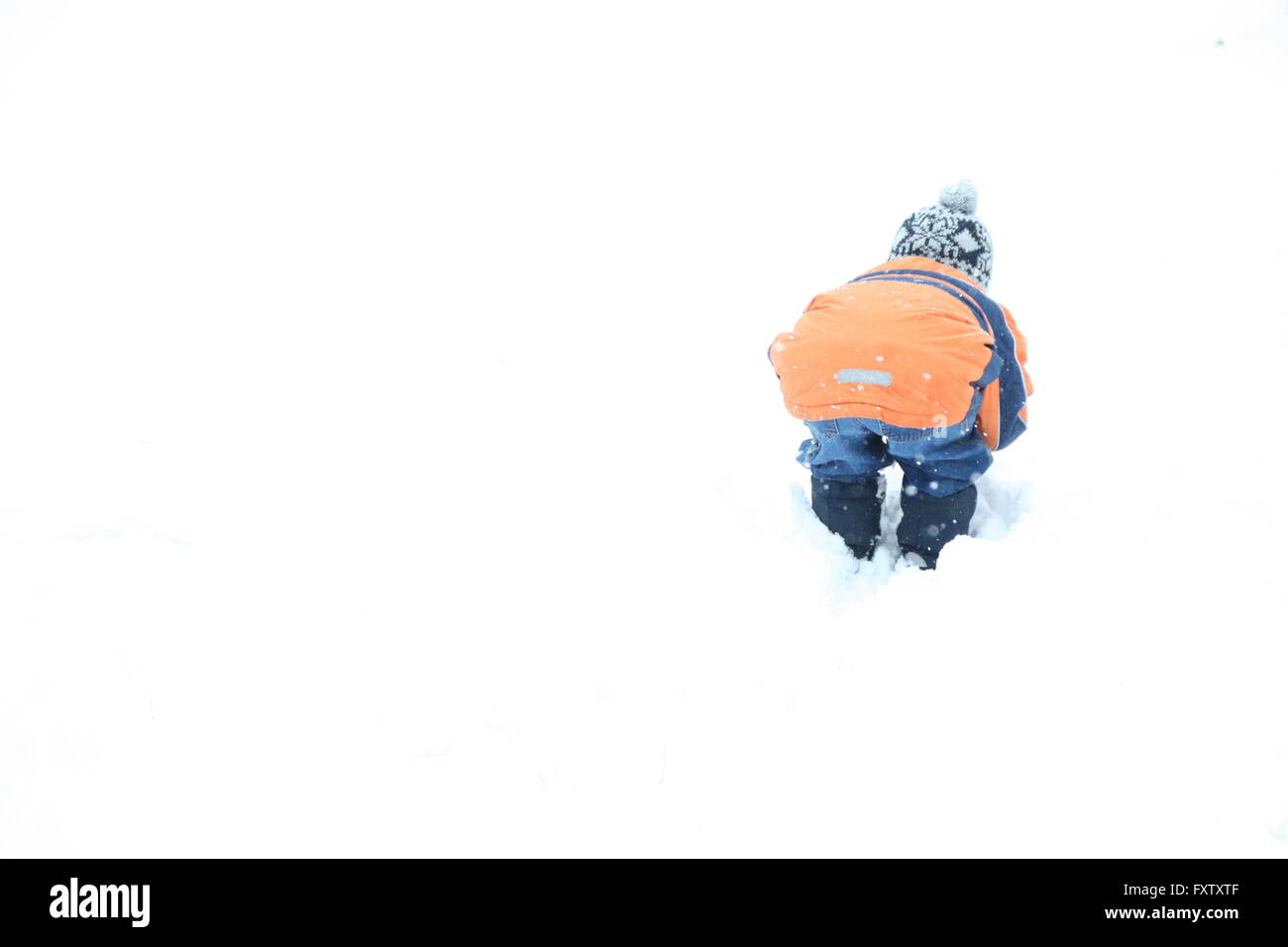Finding Snow Child discovering snow Stock Photo - Alamy