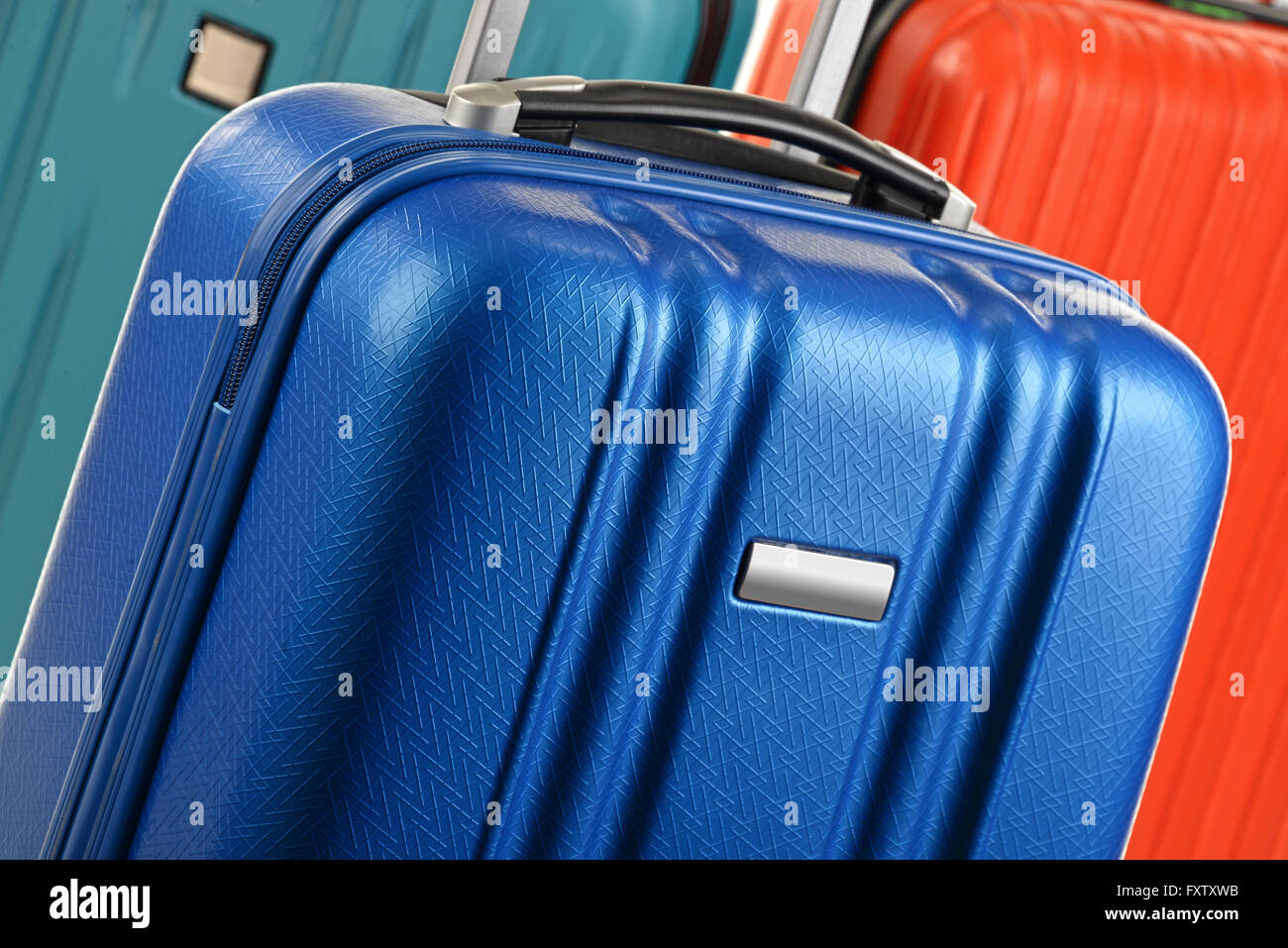 Plastic travel suitcases. Hand luggage Stock Photo Alamy