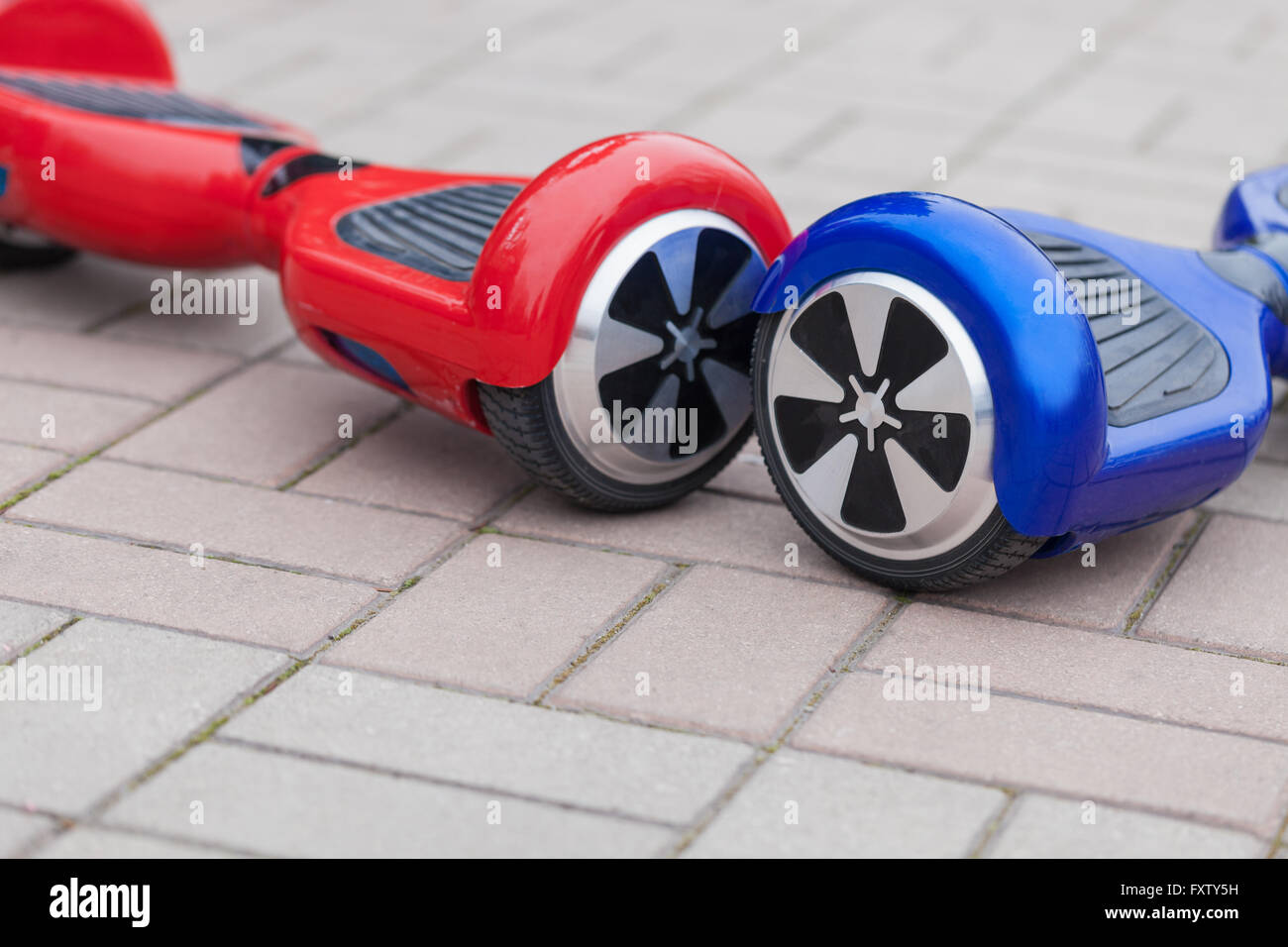Modern transportation technology - electric mini segway scooter hover board. Easy and fun way to ride the city streets. Trending new gadget that became very popular among youth and adults. This is the future of energy effetive personal urban transport that produces no pollution to the atmosphere. Stock Photo