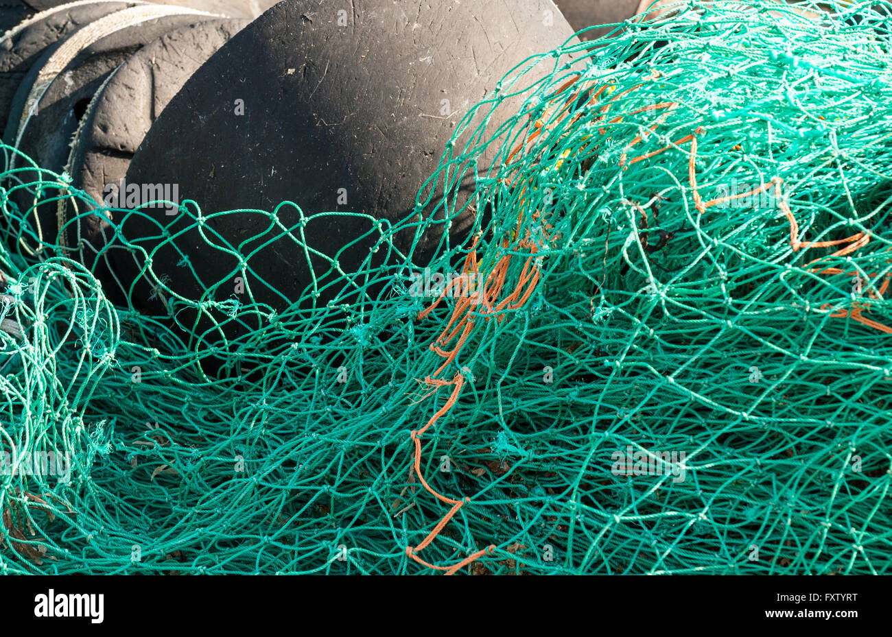 Fishing Nets Floating On The Sea On A Wood Stock Photo, Picture and Royalty  Free Image. Image 97131778.