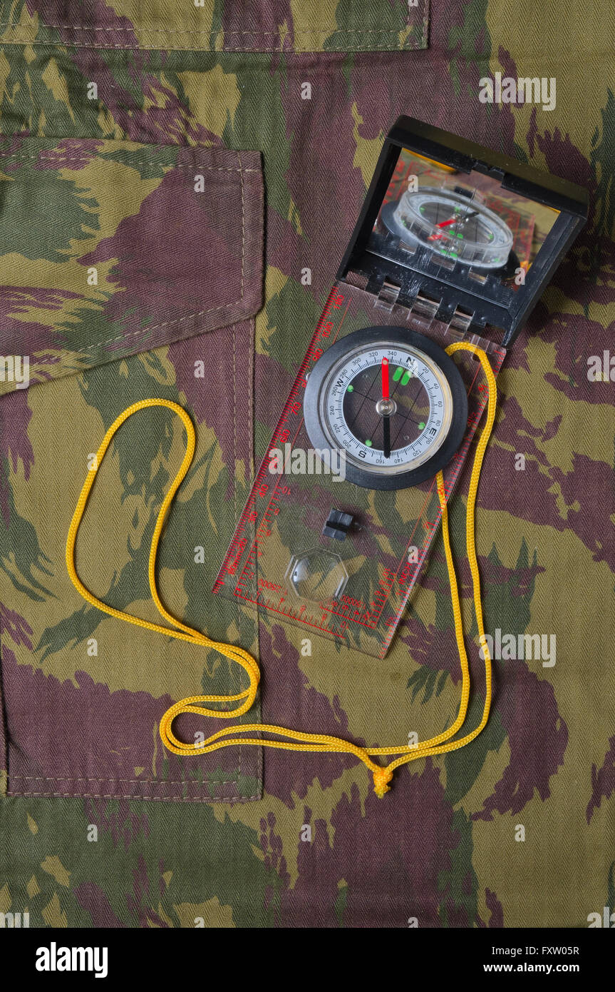 Military camo pants, map and compass. Tactical and survival outdoor
