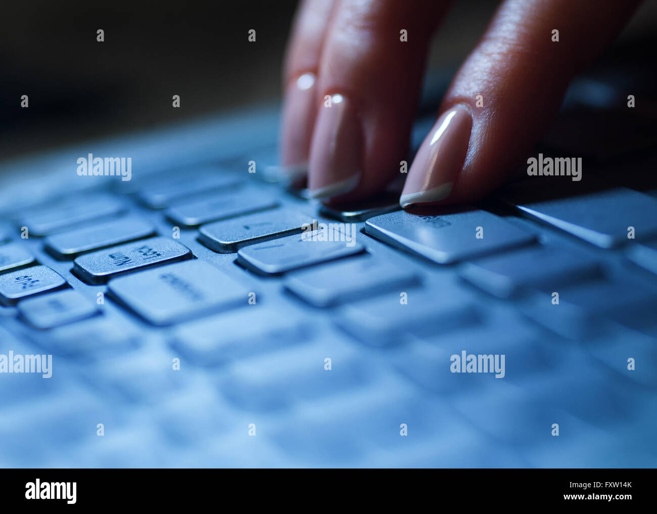 Female hands or woman office worker typing on the keyboard Stock Photo