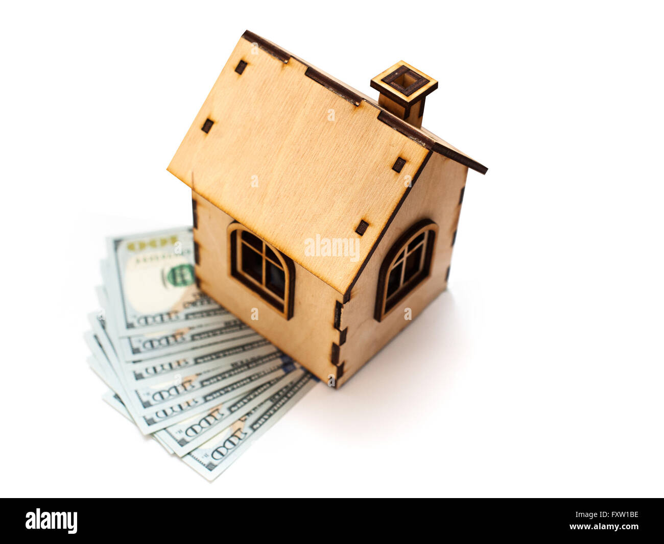 House shape made of wooden blocks and currencies dollar lying on electrical construction Stock Photo