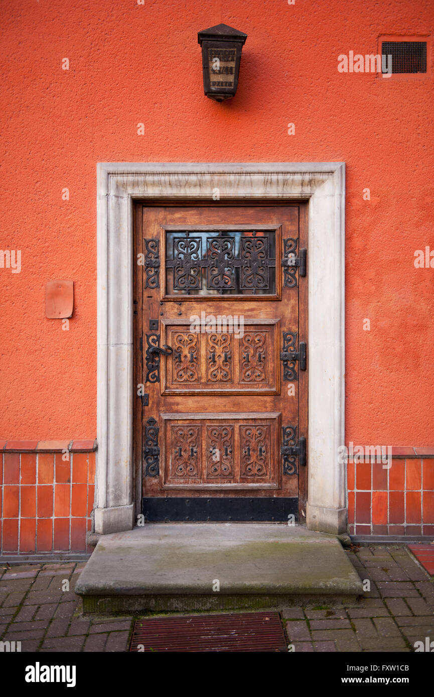 Decorative wooden doors in Gdansk at the Swietojanska 43/44 Street, Polski Zwiazek Inzynierow i Technikow Budownictwa building. Stock Photo