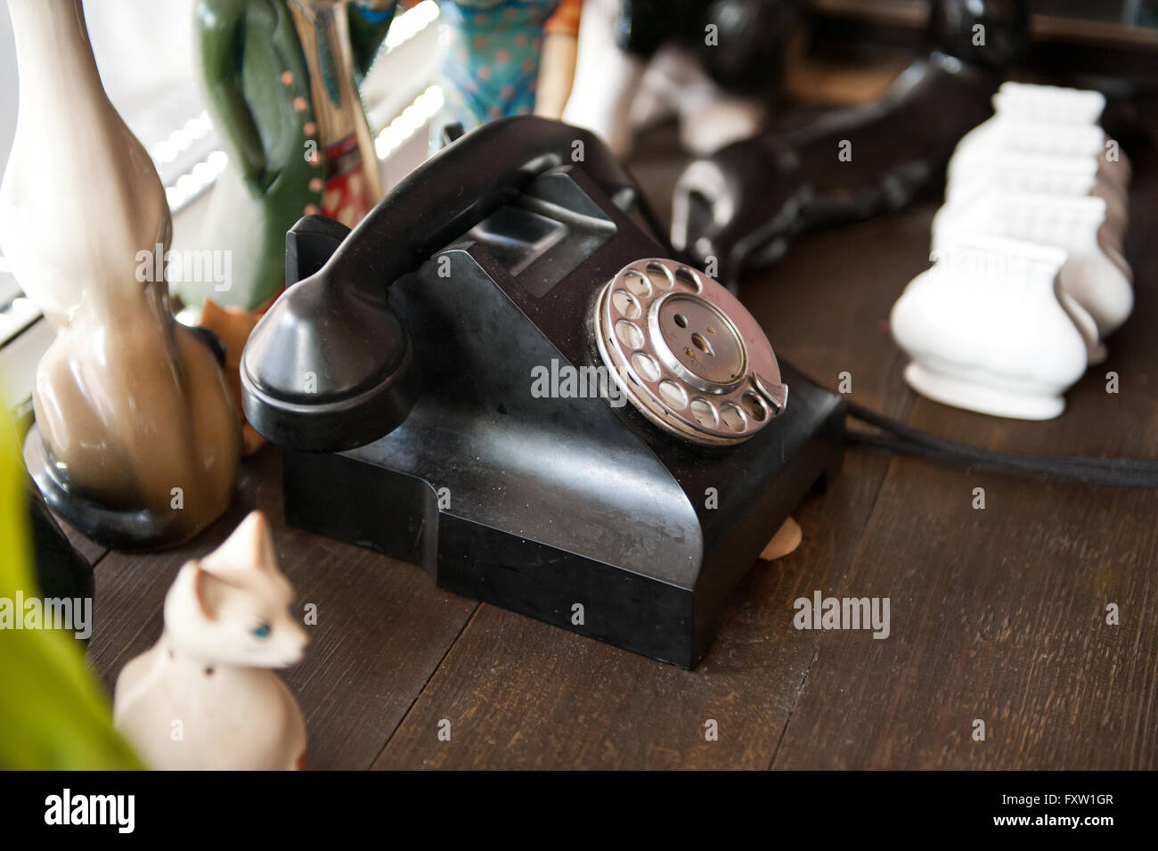 Old retro black telephone with rotary dial in Jacobsen Restaurant interior in Gdansk, Poland, Europe, windowsill decorations Stock Photo