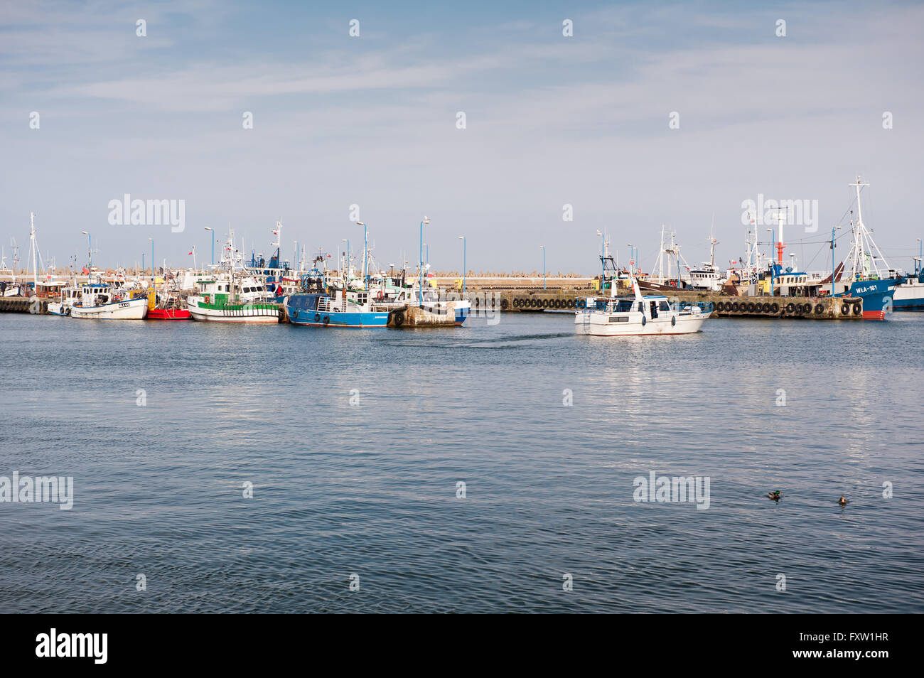 Fishing vessels on water at Szkuner harbour in Wladyslawowo, Poland, Europe. Moored ships in a Schooner fishing docks. Stock Photo