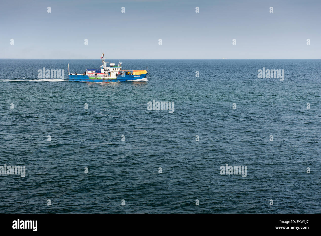 Fishing vessel at the Baltic Sea, horizon view from Wladyslawowo harbour in Poland, Europe, ship belong to Szkuner maritime port Stock Photo