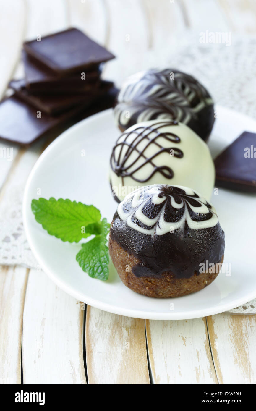 dessert biscuit balls cakes with chocolate icing Stock Photo