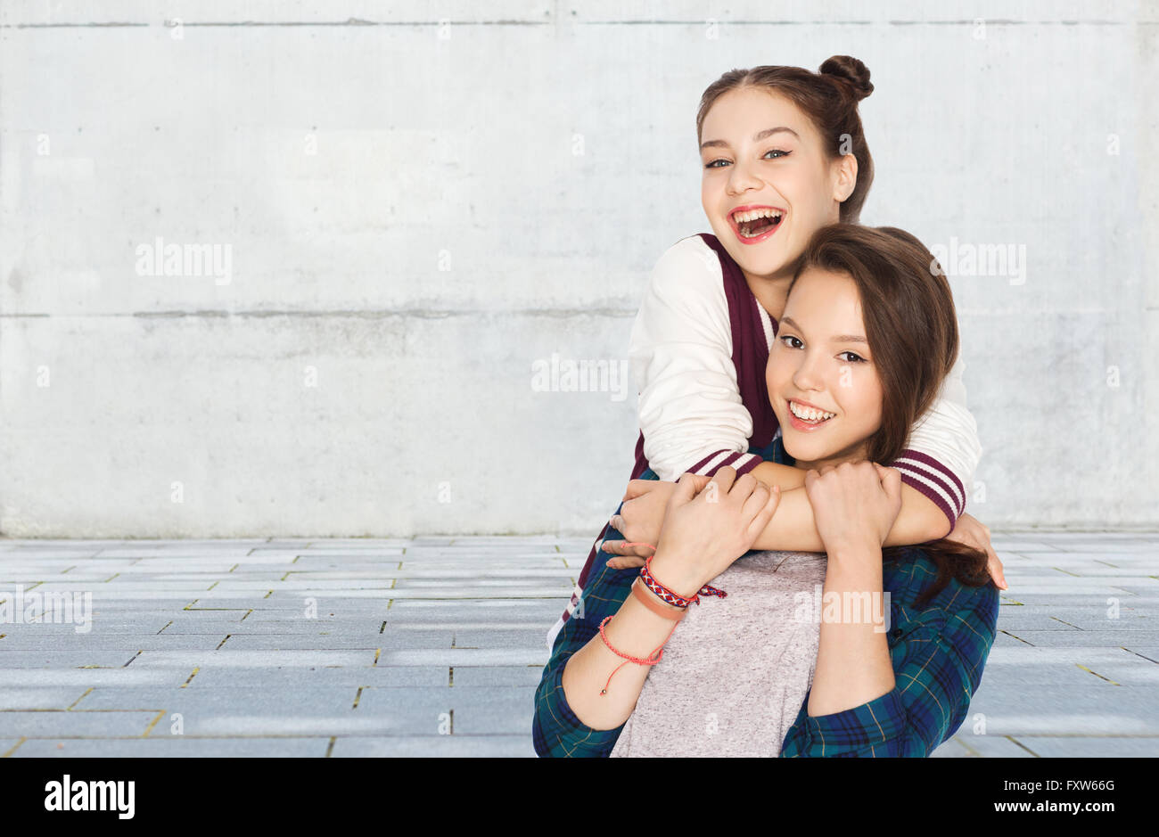 happy smiling pretty teenage girls hugging Stock Photo - Alamy