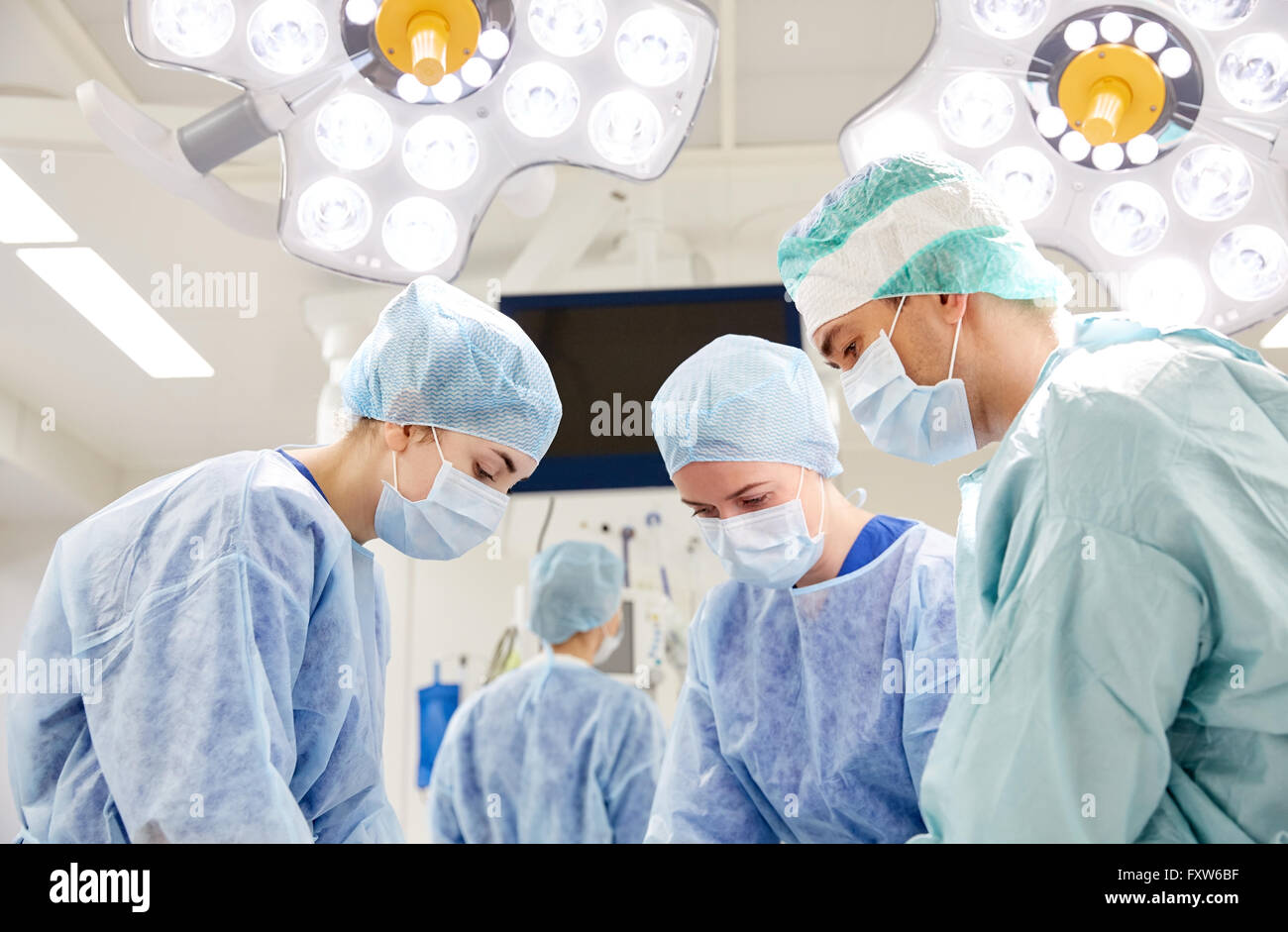 group of surgeons in operating room at hospital Stock Photo - Alamy