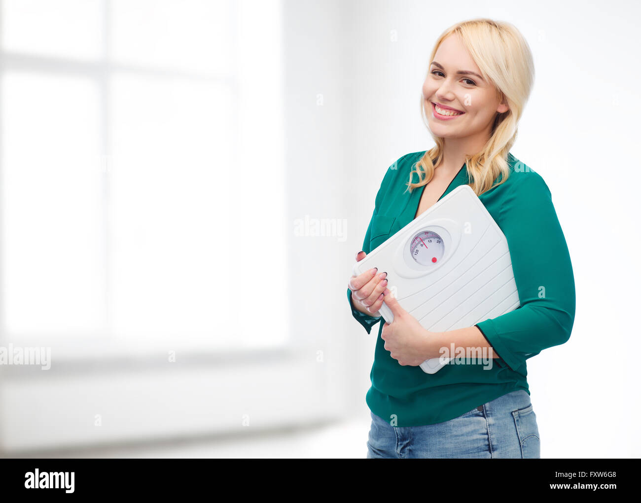 Woman scale weight loss happy hi-res stock photography and images - Alamy