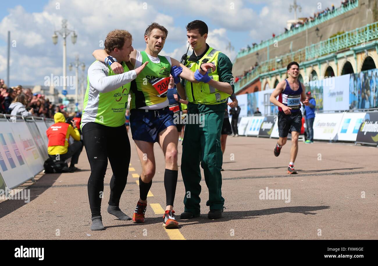 A runner is helped across the finish line during the 2016 Brighton