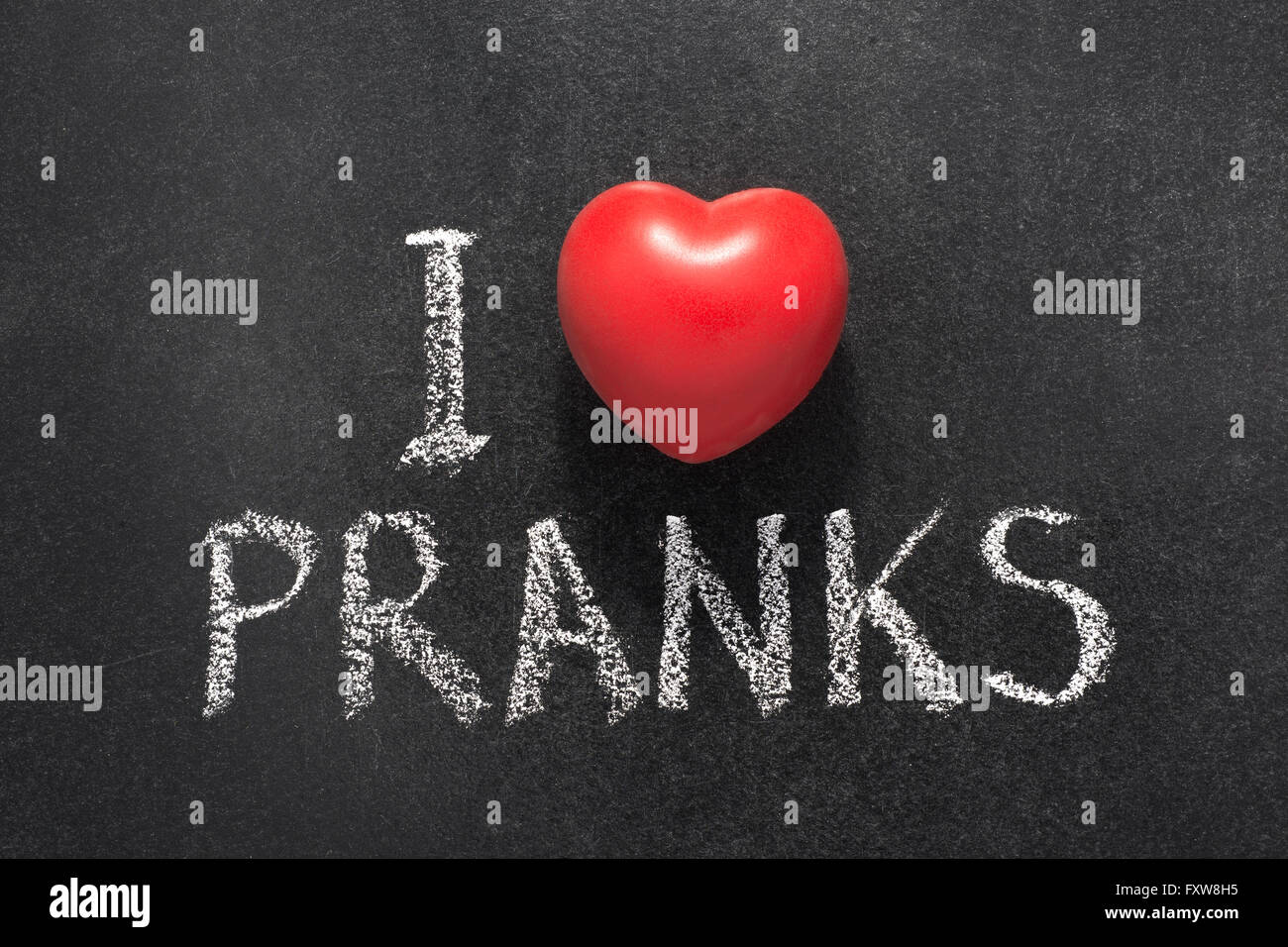 I love pranks phrase handwritten on blackboard with red heart shape Stock Photo