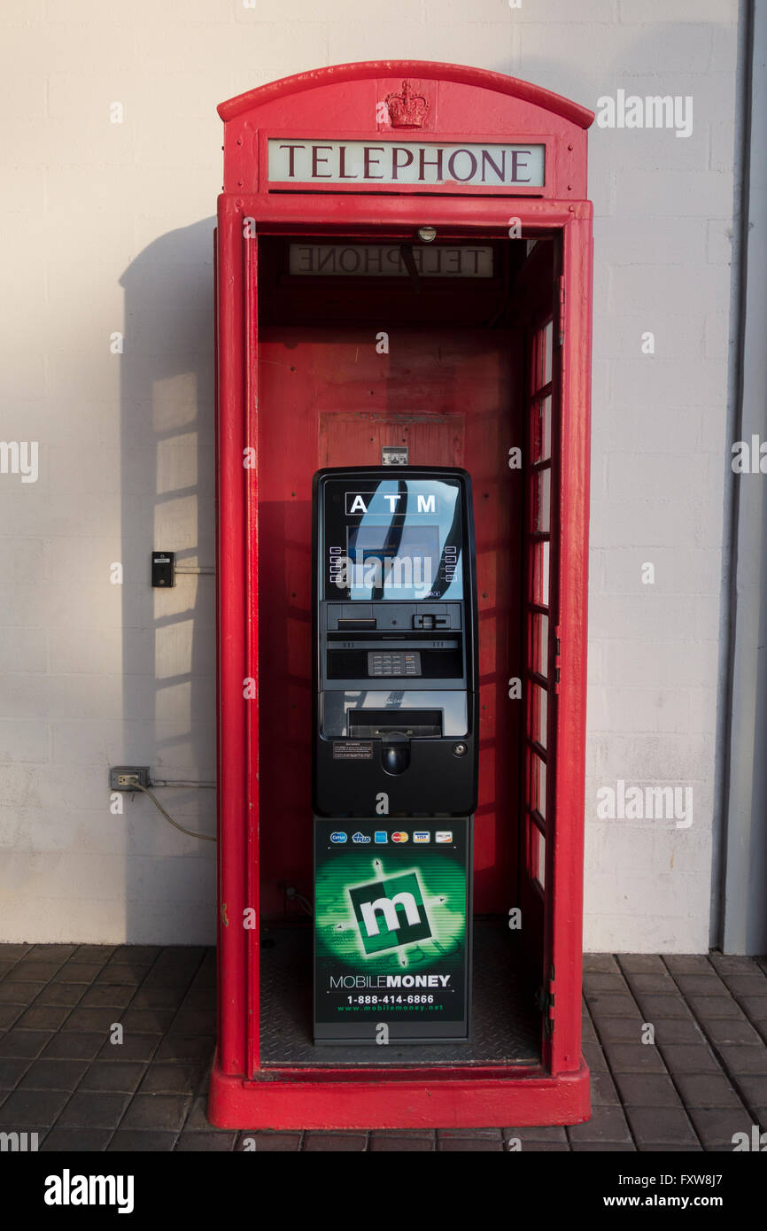 An ATM in an old style UK telephone box in longbeach California Stock Photo