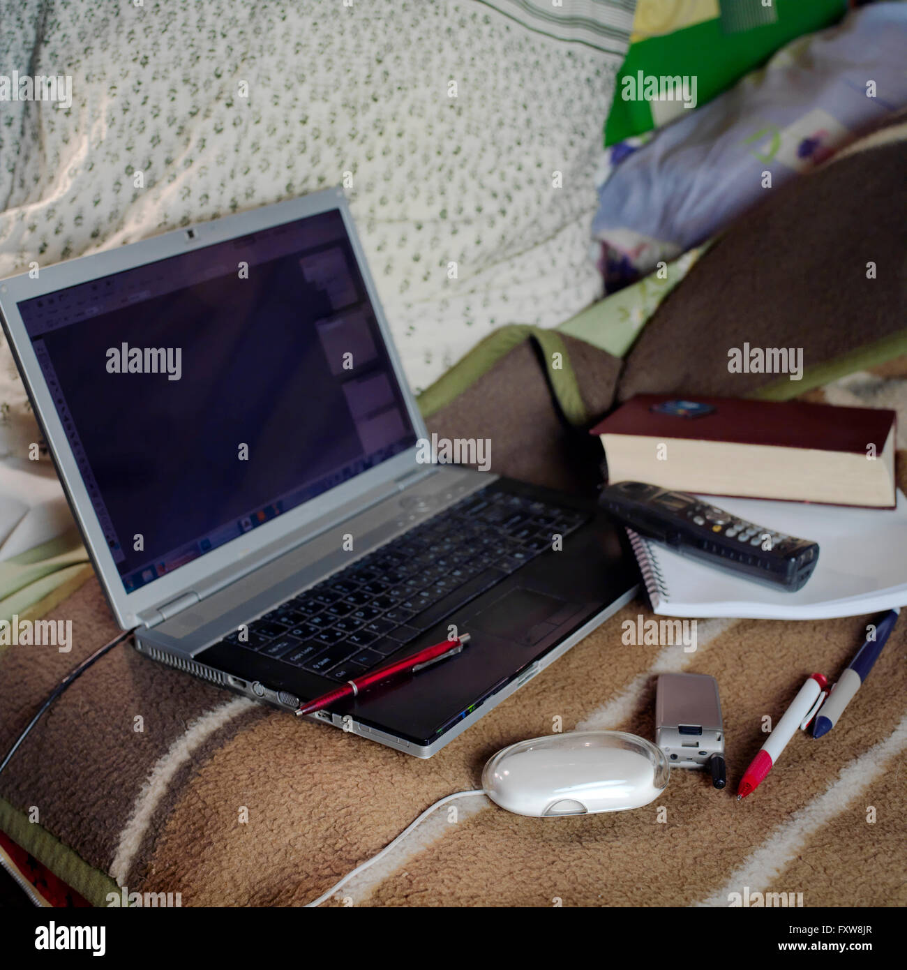 Laptop On A Bed Stock Photo Alamy