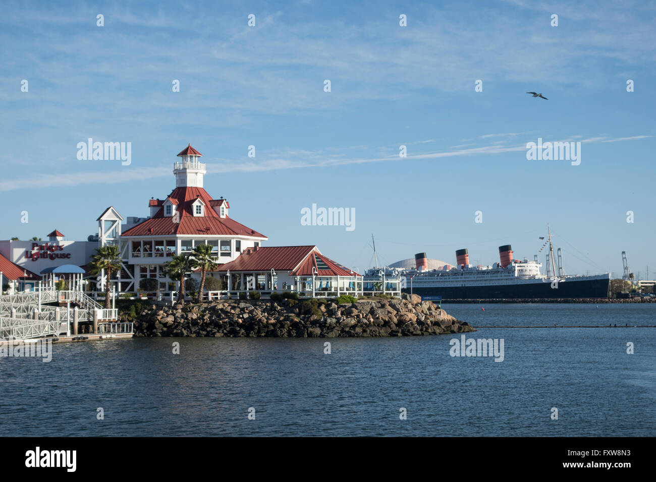 The shoreline village at Longbeach California with the Queen Mary liner in the background Stock Photo