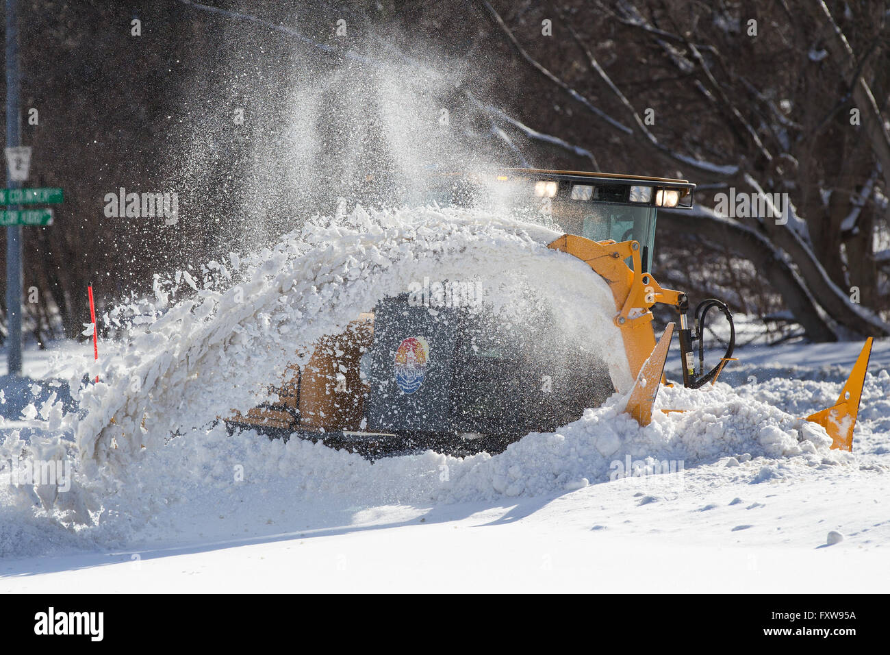 A snow plow clears a sidewalk in Kingston, Ont., on Thursday Feb. 18